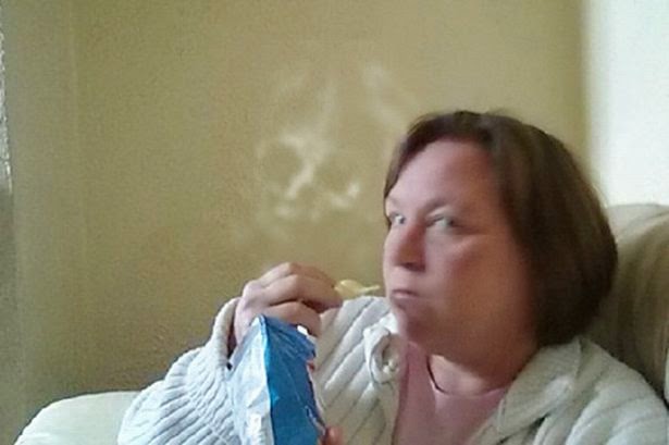 Spooky Face Appears in Photo of Woman at Home